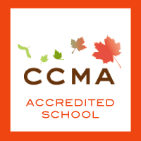 A logo for the ccma accredited school.